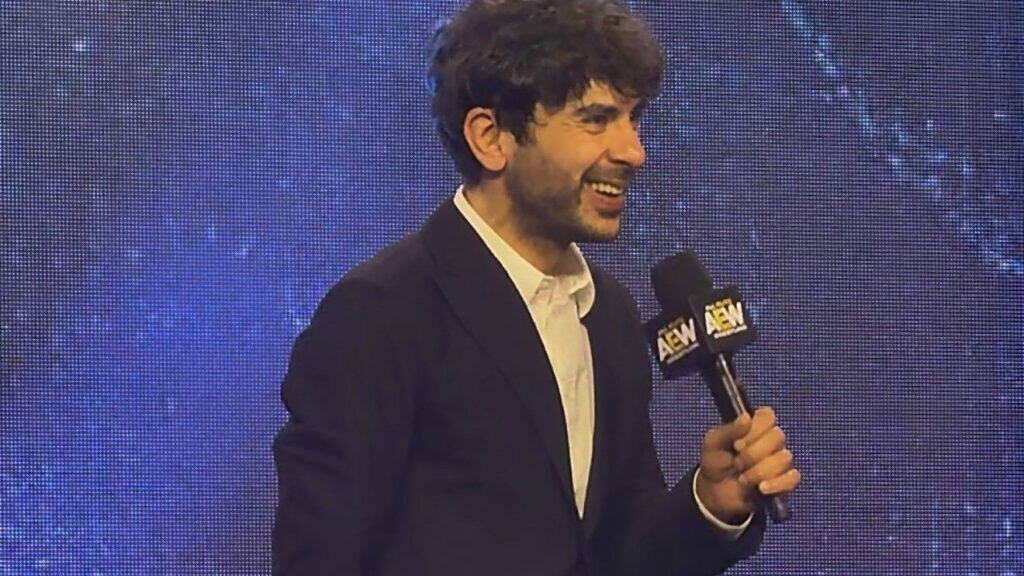 Tony Khan speaks to the crowd after AEW Dynamite at the Watsco Center in Coral Gables, Florida