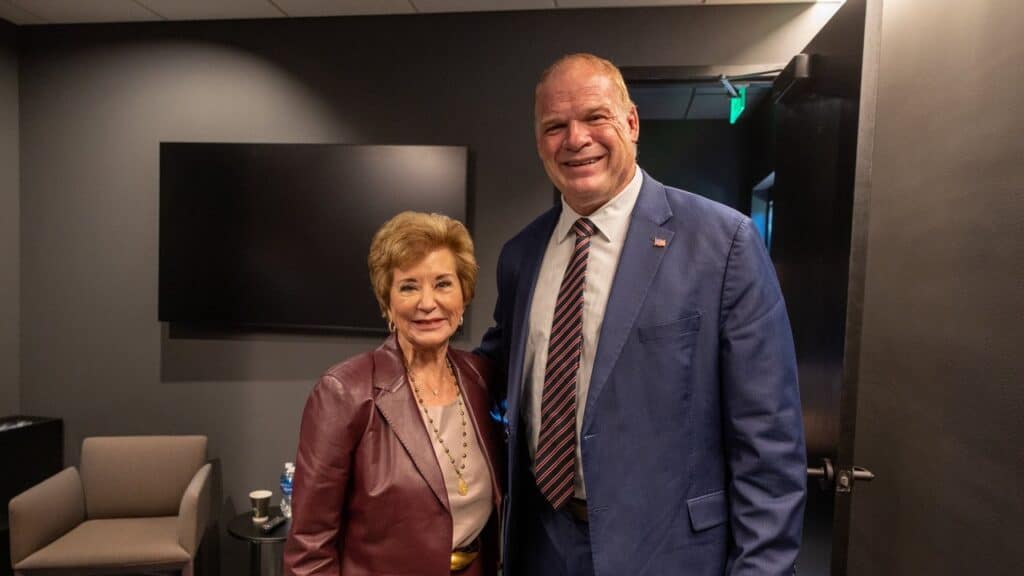 Glenn Jacobs, who wrestled as Kane, smiling backstage with Linda McMahon at Vanderbilt University